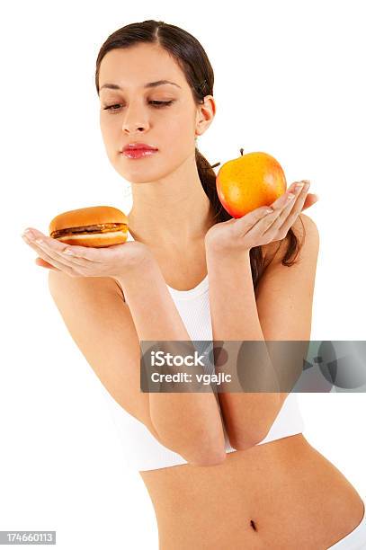 Woman Holding Apple And Hamburger Stock Photo - Download Image Now - Adult, Adults Only, Apple - Fruit