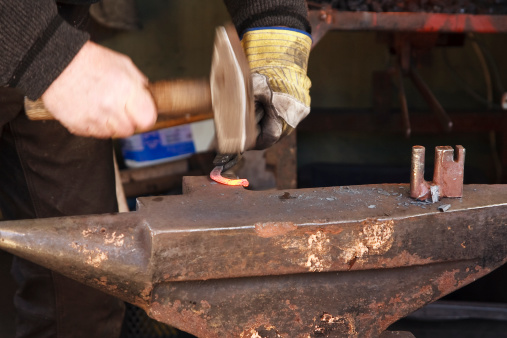 Hands of blacksmith.