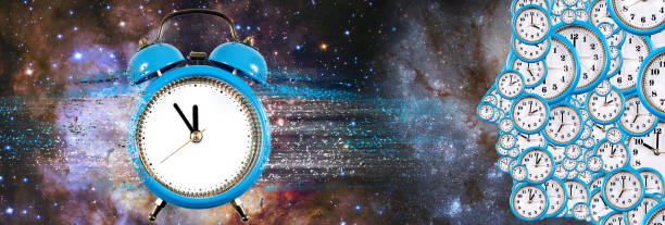 istock An image of a clock, from which particles and a human head are separated, made from various clock faces. 1746610391