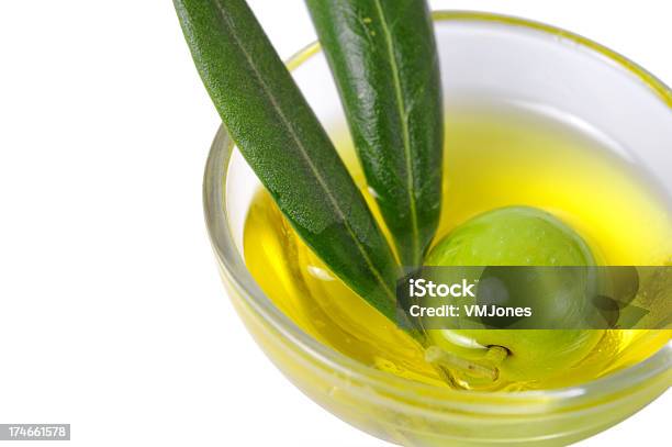 Green Olive In Oil Stock Photo - Download Image Now - Bowl, Close-up, Cooking Oil