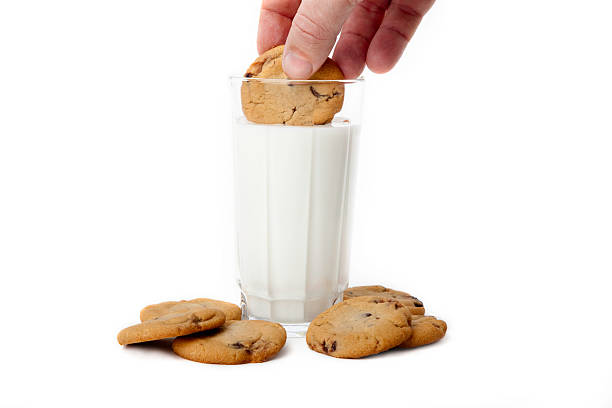 Dipping cookies stock photo