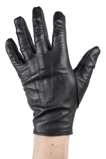 Open hand with black leather glove. Isolated on white.See also: