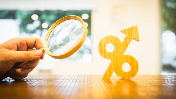 Magnifying glass with percent icon. Discount offers searching. Search for discount sale sign. Finding the lowest interest for real estate loans. stock photo