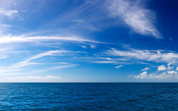 The Deep Blue Sea Stitched panorama of the open ocean. cirrus stock pictures, royalty-free photos & images