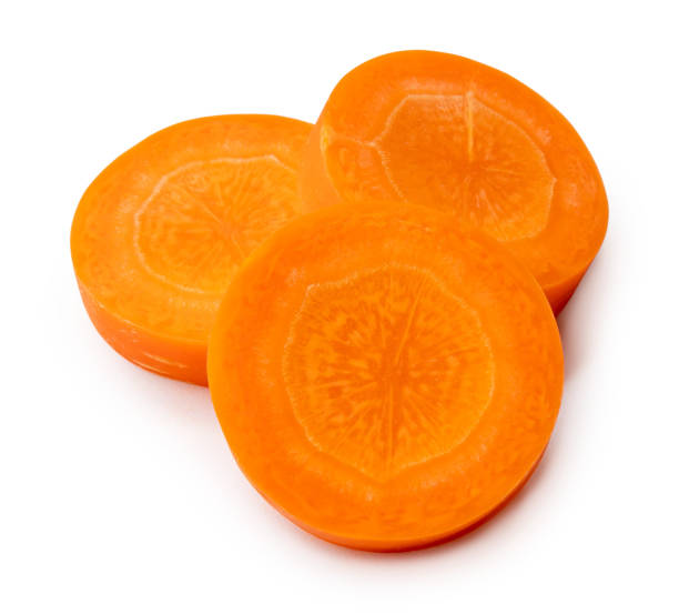 istock Beautiful orange  carrot slices in stack isolated on white background with clipping path 1746631134