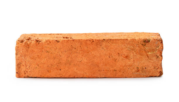istock Single cracked old red or orange brick isolated on white background with clipping path 1746631776