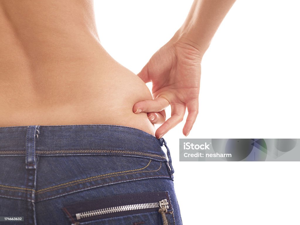 Fat measuring A woman measuring the thickness of her fat. Abdomen Stock Photo