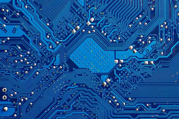 Photo of Closeup of a blue computer circuit board