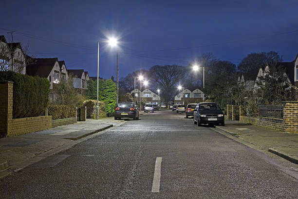 Suburban Street at Night-More in lightboxes below A modern street scene with small townhouses lit by street lamps.Please see the following lightboxes for more anglo saxon photos stock pictures, royalty-free photos & images