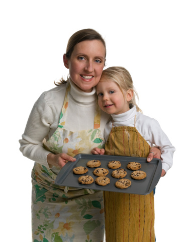A mom and her young son presenting their freshly baked cookies