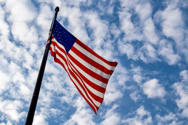 istock American flag flying against blue sky 1746645557