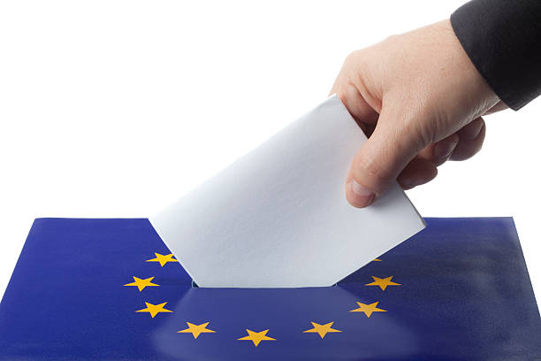 istock Male hand inserting ballot to EU ballot box 174665157