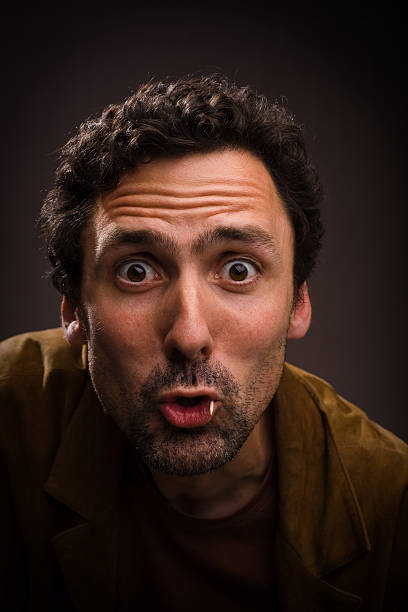 istock Man making funny face with toothpick in mouth 174665904