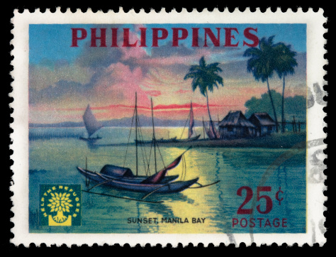 1960 Philippines postage stamp with an illustration of a sunset over Manila Bay. DSLR with 100mm macro; no sharpening.