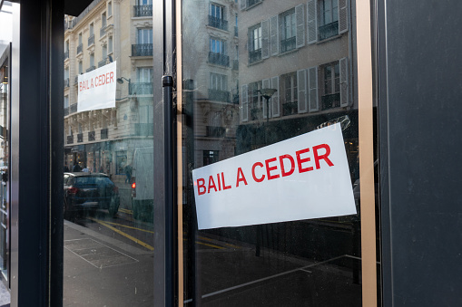 Paris, France - October 19, 2023: 'Bail à céder' sign (ie: Lease to transfer) written in French on the window of professional or commercial premises. Concept of French professional real estate market
