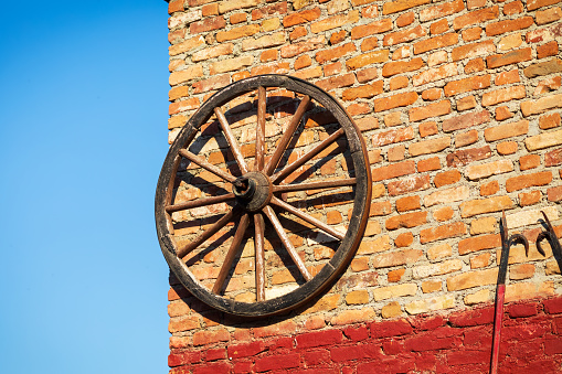An old decorative horse carriage wheel.