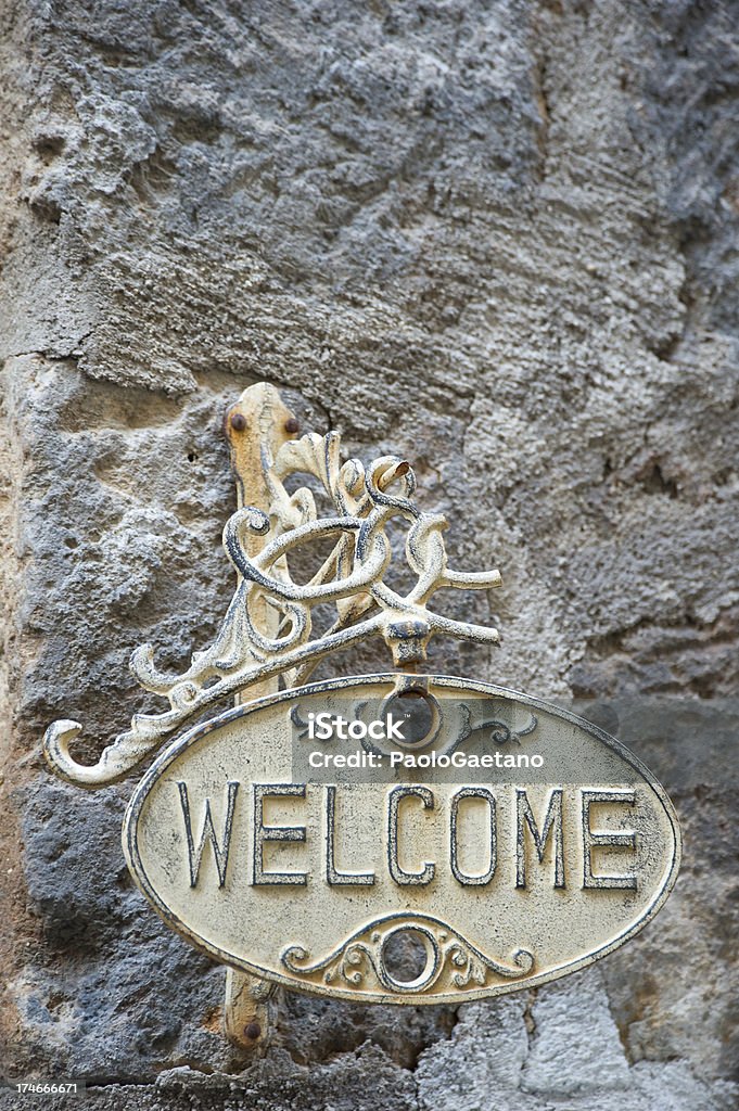 Welcome Plate outside the door hanging on the wall. Arrival Stock Photo