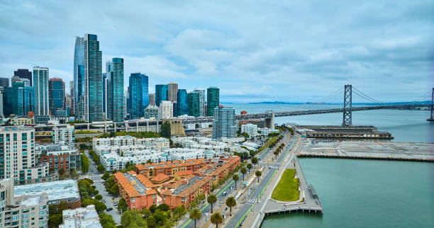 istock Aerial Oakland Bay Bridge from San Francisco Bay with downtown skyscrapers 1746668607