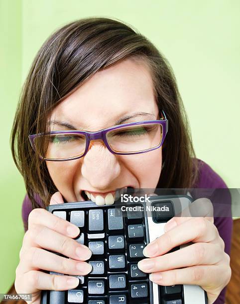 Computer Frustration Stock Photo - Download Image Now - Biting, Computer, Computer Keyboard