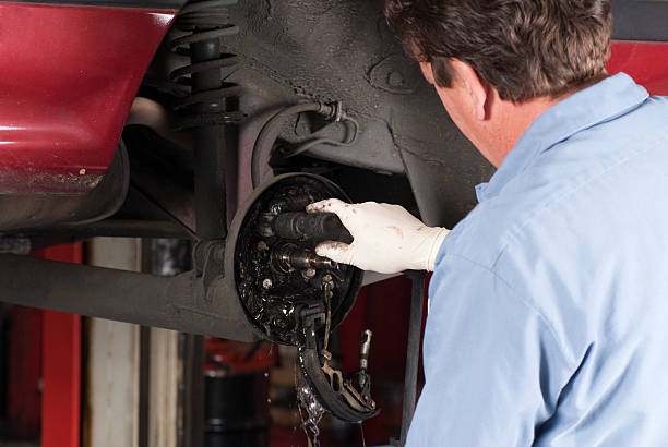istock Auto Mechanic Cleaning Brakes 174667204