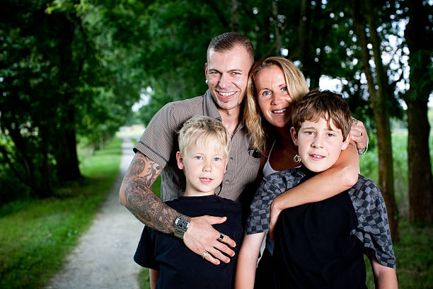 istock Young Family Posing In A Park 174667354