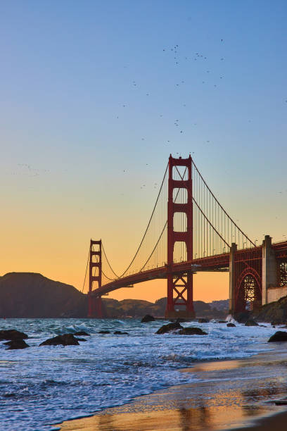 istock Blue hour on sandy shore with receding waves and Golden Gate Bridge 1746679122