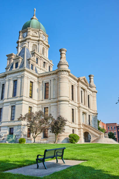 istock Bright summer day with a bench in front of a castle like courthouse 1746683609