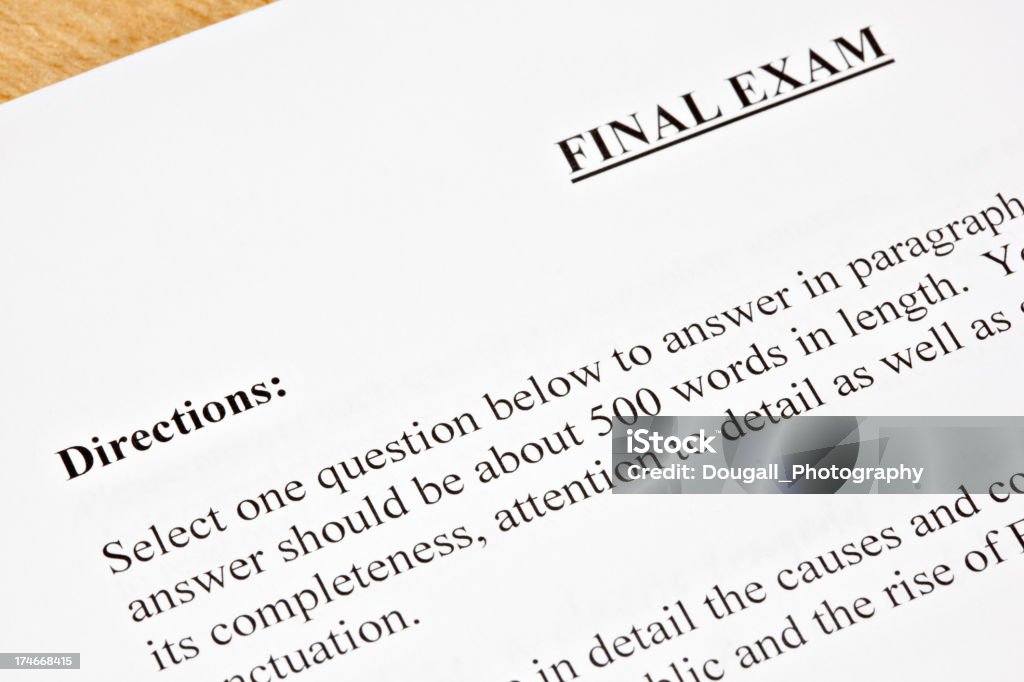 Final Exam Detail Detail of final exam showing title and directions.  Exam paper is sitting on a student's desk. Comparison Stock Photo