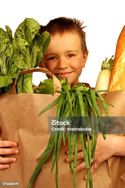Boy With Purchases Stock Photo - Download Image Now - Boys, Elementary Age, Paper Bag