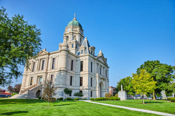 istock Castle like courthouse with statue out front and deep blue skies overhead on summer day 1746684713