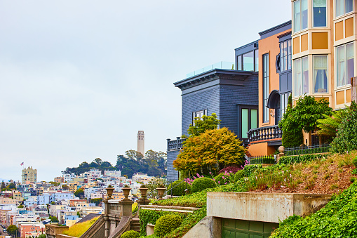 Image of Close together housing with distant view of city below Telegraph Hill with Coit Tower