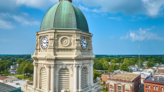 Image of Close up of Columbia City courthouse clock tower with dome and blue sky aerial