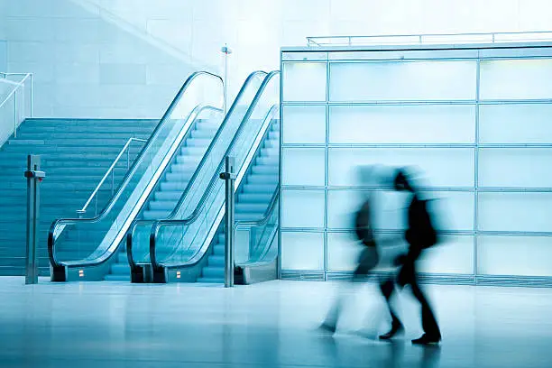 Photo of People Walking in Corridor