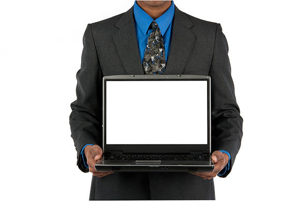 Businessman showing a laptop screen stock photo