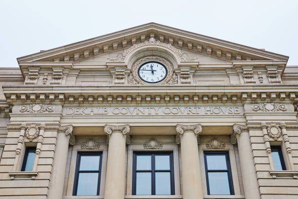 istock Dekalb County Court House engraved on building with clock approaching noon on courthouse 1746699054
