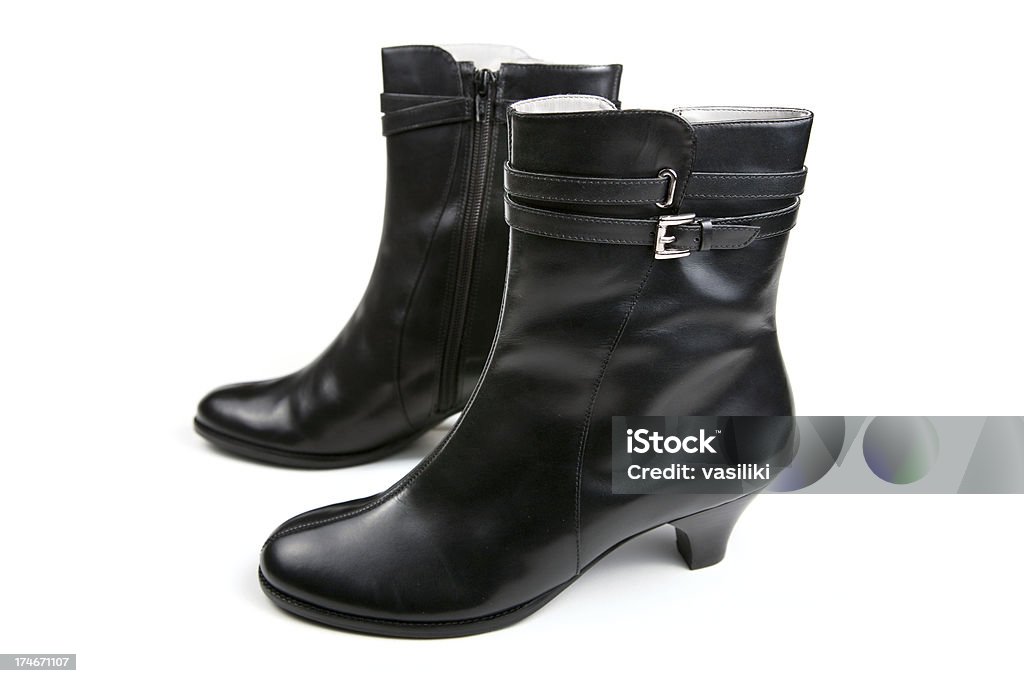 Female black boots Female black leather boots isolated on white.See also Beauty Stock Photo