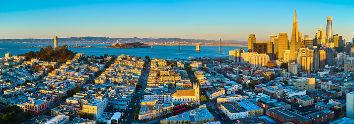 Image of Gorgeous panorama at golden hour with Coit Tower to Transamerica Pyramid skyscraper buildings