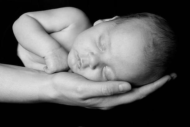 istock Mother Holding Baby 174671533