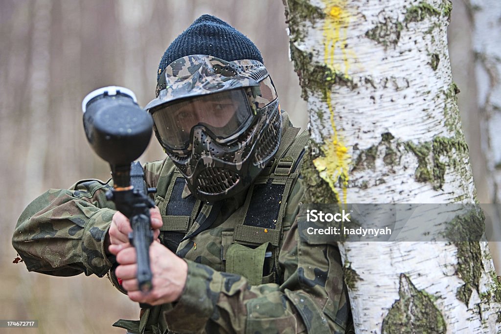 Paintball player Aiming paintball player with mask Adult Stock Photo