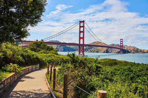Image of Path with railing leading to Golden Gate Bridge in San Francisco Bay on gorgeous summer day