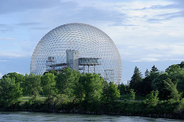 Landscape with trees and river with geodetic dome in back "Geodesic dome, Biosphere in montreal, Canada. More Montreal in lightbox..." geodesic dome stock pictures, royalty-free photos & images