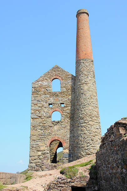 istock Remnant of tin mine Cornwall England with chimney 174674038
