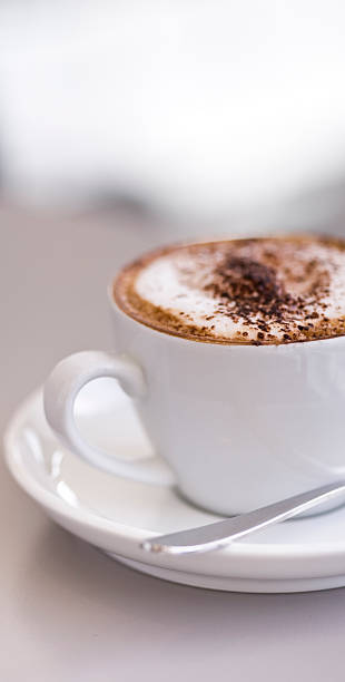 Coffee Cappuccino in cup & saucer stock photo