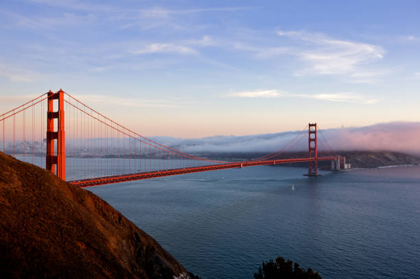 istock Golden Gate Bridge at sunset with fog 174674362