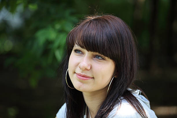 istock young woman on street 174674577
