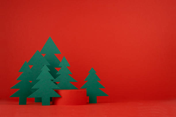 istock Christmas festive stage with cylinder podium mockup, 3d rendering for presentation gifts, cosmetic products, goods with green spruces in traditional red, green color, copy space. New year template. 1746747410