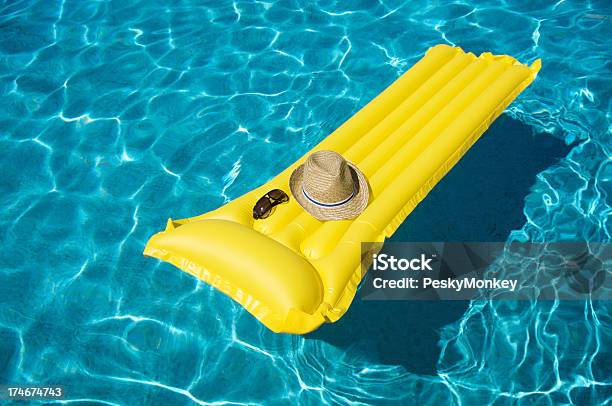 Yellow Pool Raft Floats With Hat And Sunglasses Stock Photo - Download Image Now - Floating On Water, Pool Raft, Sunglasses