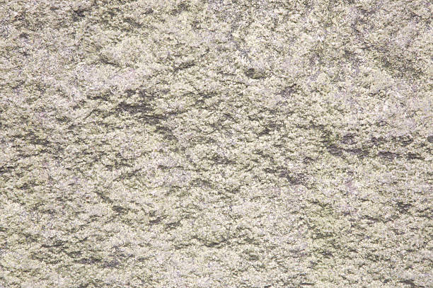 Rough textured yellow japanese granite Rough textured yellow granite. roughhewn stock pictures, royalty-free photos & images