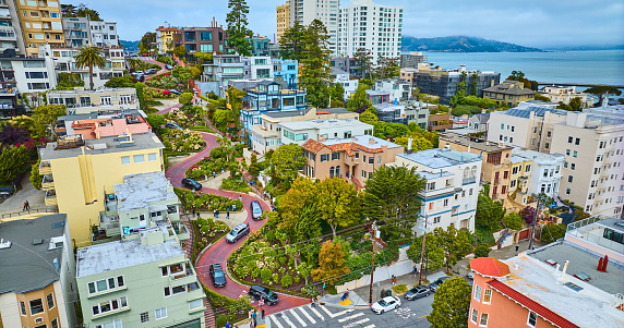 Image of Side view Lombard Street with aerial of San Francisco Bay and residential buildings