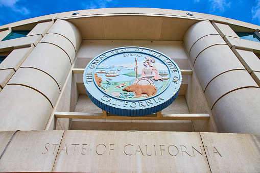 Image of State of California The Great Seal of the State of California coin on building